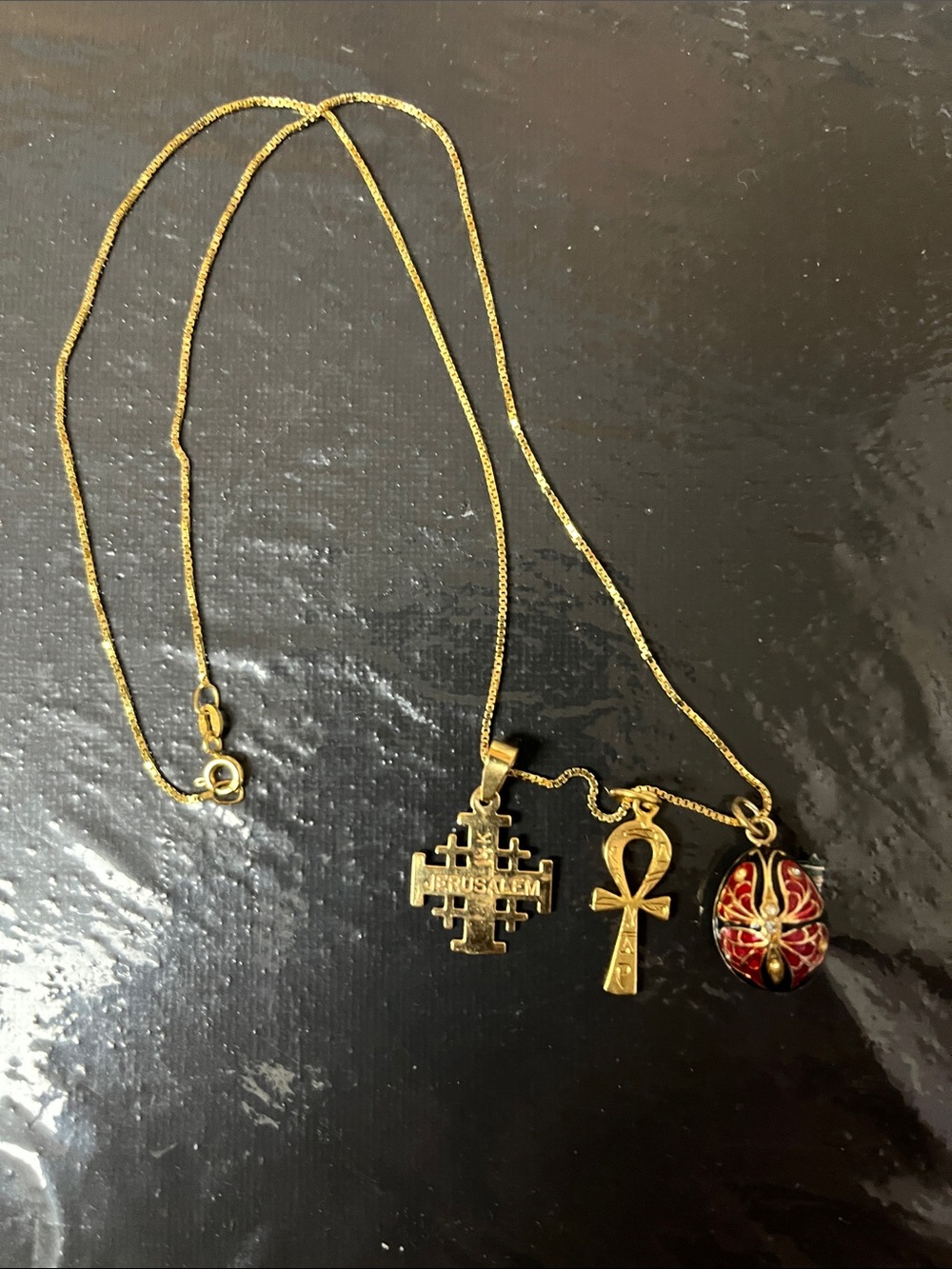 14kt Gold Chain with three 14Kt Gold Charms all sold together.
